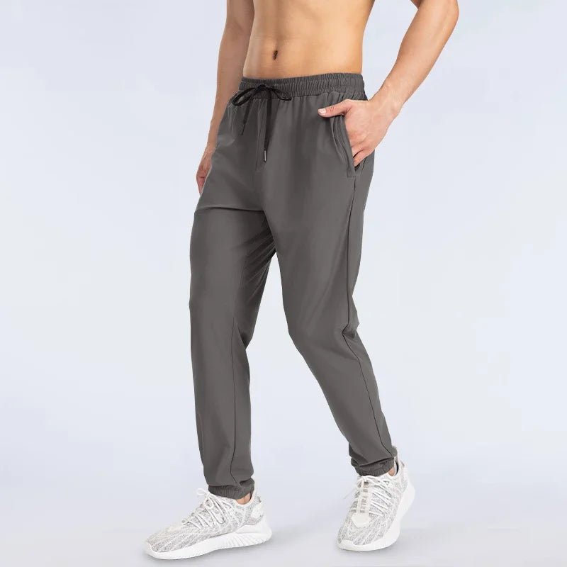 Men's sports trousers are loose, quick - drying, elastic, and suitable for casual running and fitness - TheGlamTrend14:365458;5:4182XXLBrownMen's sports trousers are loose, quick - drying, elastic, and suitable for casual running and fitness